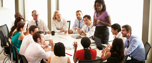 People sitting at a table in a meeting